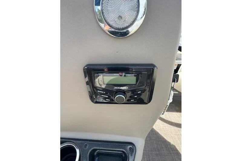 Slide: The Image of Kicker stereo system on 2022 Sun Tracker Bass Buggy 18 DLX boat dashboard. - 17