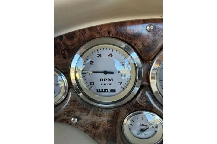 Slide: The Image of Dashboard of a 2001 Stingray 240 LS boat showing RPM gauge. - 9