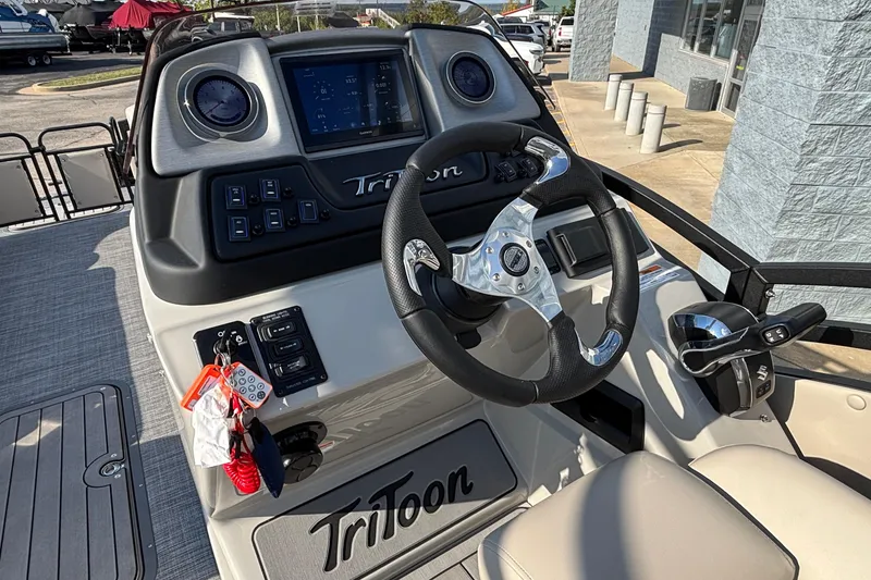 Slide: The Image of Steering console of 2026 JC Neptoon 25TT Sport pontoon boat, featuring modern controls and dashboard. - 19
