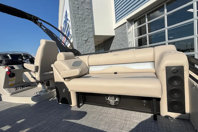 Slide: The Image of 2026 JC Neptoon 25TT Sport boat interior with beige seating and modern dashboard. - 29