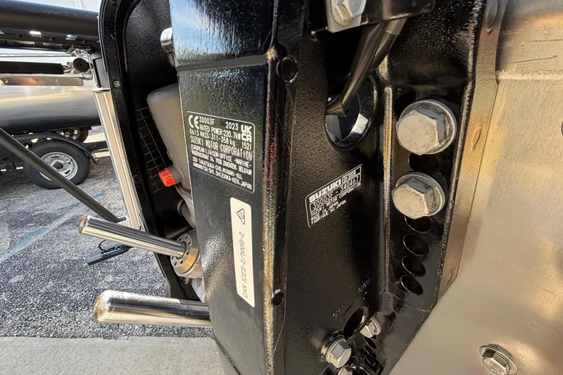 Slide: The Image of Close-up of a 2026 JC Neptoon 25TT Sport engine components and labels. - 36