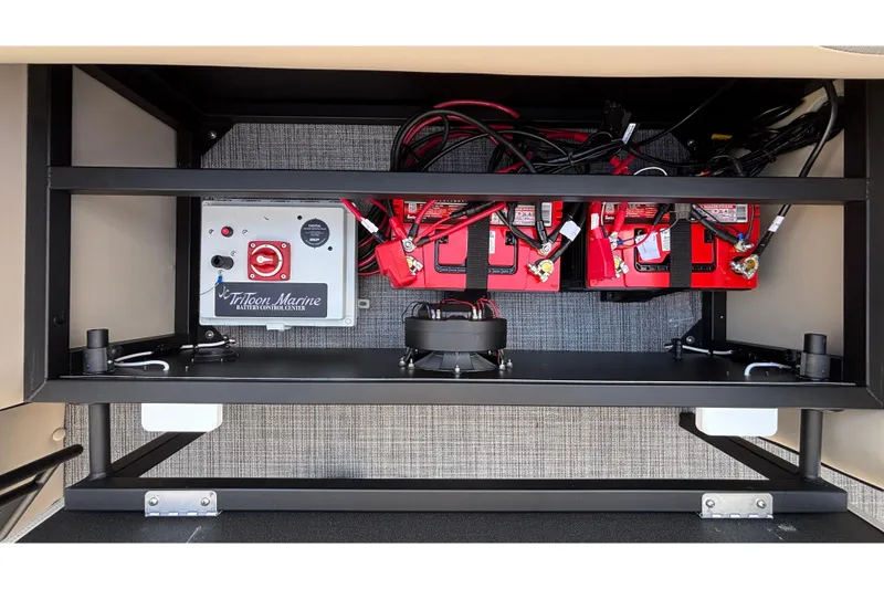 Slide: The Image of Battery control center of 2026 JC Neptoon 25TT Sport with red batteries and wiring. - 38