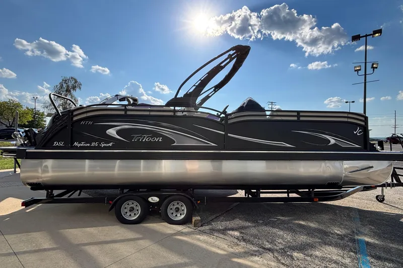 Slide: The Image of 2026 JC Neptoon 25TT Sport pontoon boat on trailer under sunny sky. - 5