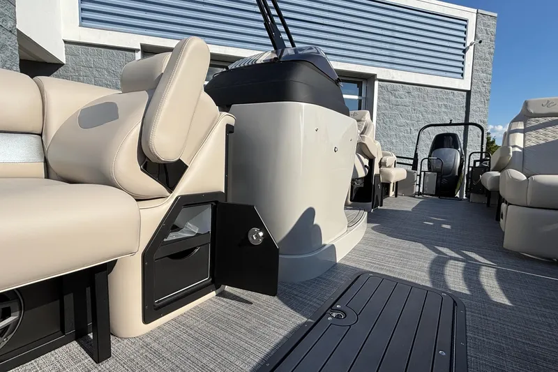 Slide: The Image of 2026 JC Neptoon 25TT Sport boat interior with beige seating and modern design. - 13