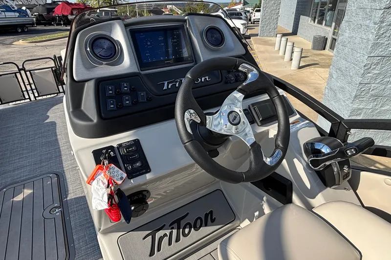 Slide: The Image of Steering console of 2026 JC Neptoon 25TT Sport boat with modern controls and display. - 20