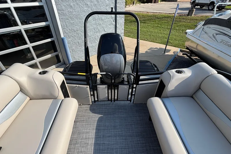 Slide: The Image of 2026 JC Neptoon 25TT Sport pontoon boat interior with plush seating and modern design. - 24