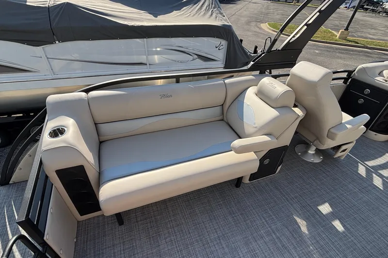 Slide: The Image of Luxurious seating on 2026 JC Neptoon 25TT Sport pontoon boat, featuring plush upholstery and cup holders. - 27
