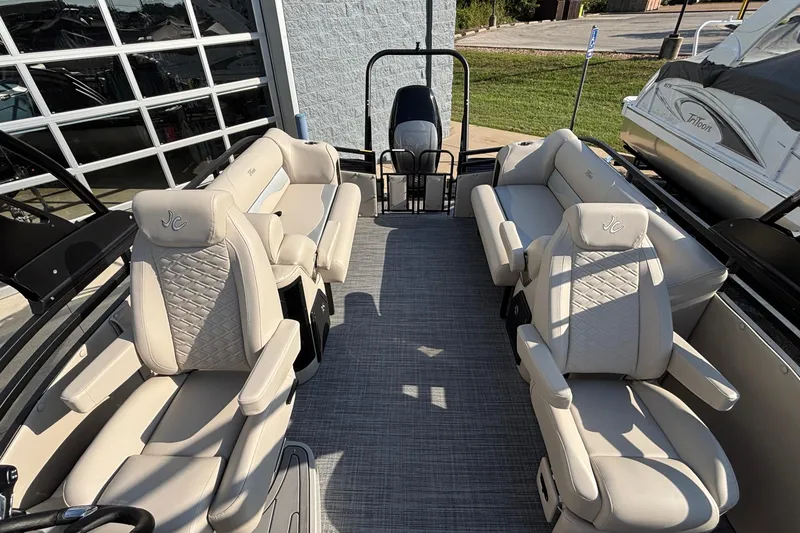 Slide: The Image of Luxurious interior of 2026 JC Neptoon 25TT Sport pontoon boat with plush seating. - 31