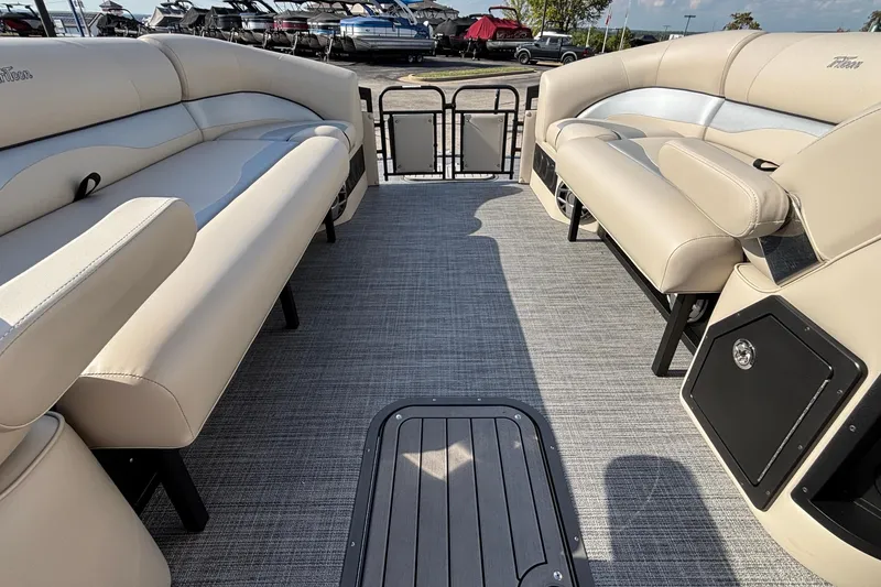 Slide: The Image of Luxurious interior of 2026 JC Neptoon 25TT Sport pontoon boat with beige seating. - 9