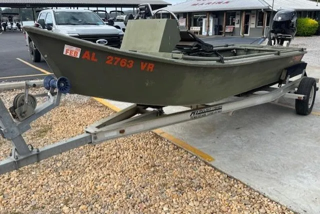 The Image of 2018 Encore Boat Works 18 on trailer, parked in a lot, side view. - 1