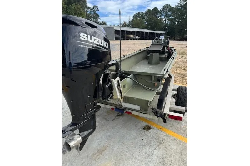 Slide: The Image of 2018 Encore Boat Works 18 with Suzuki outboard motor on trailer. - 4
