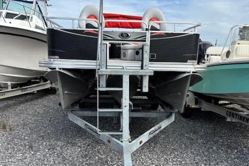 Slide: The Image of 2021 Apex Marine 822 Angler Quest Family Fish boat on trailer, parked on gravel. - 12