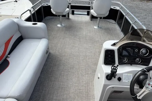 Slide: The Image of 2021 Apex Marine 822 Angler Quest Family Fish boat interior with seating and control panel. - 7