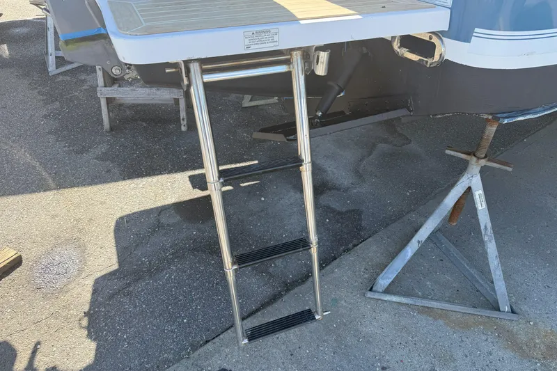 Slide: The Image of Stainless steel ladder on a 2017 Regulator 25 boat, resting on a stand. - 10