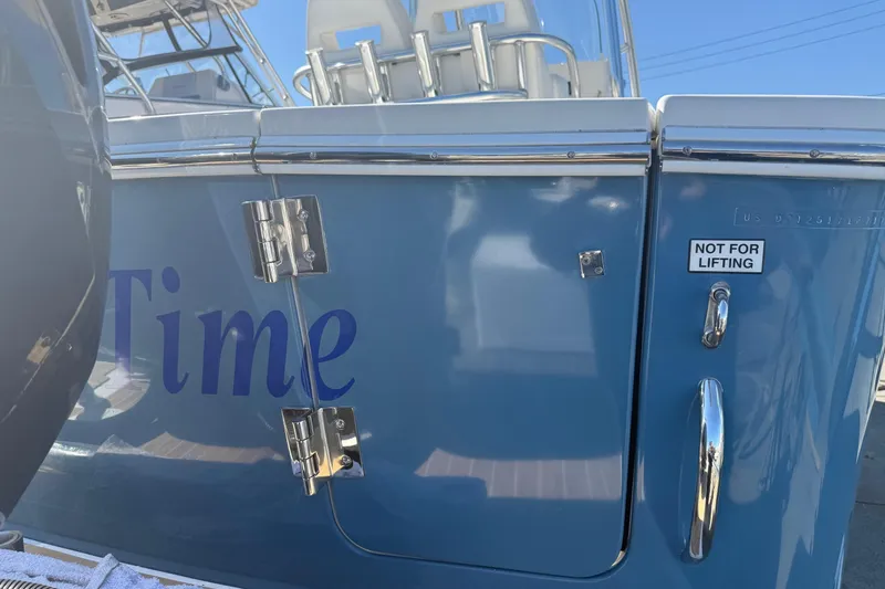 Slide: The Image of 2017 Regulator 25 boat with blue hull, chrome fittings, and "Not for Lifting" label. - 12