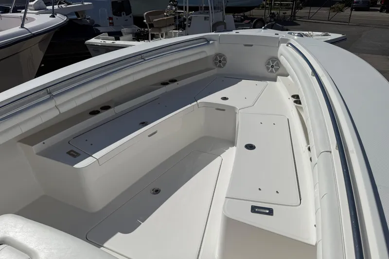 Slide: The Image of 2017 Regulator 25 boat interior with spacious seating and storage compartments. - 26