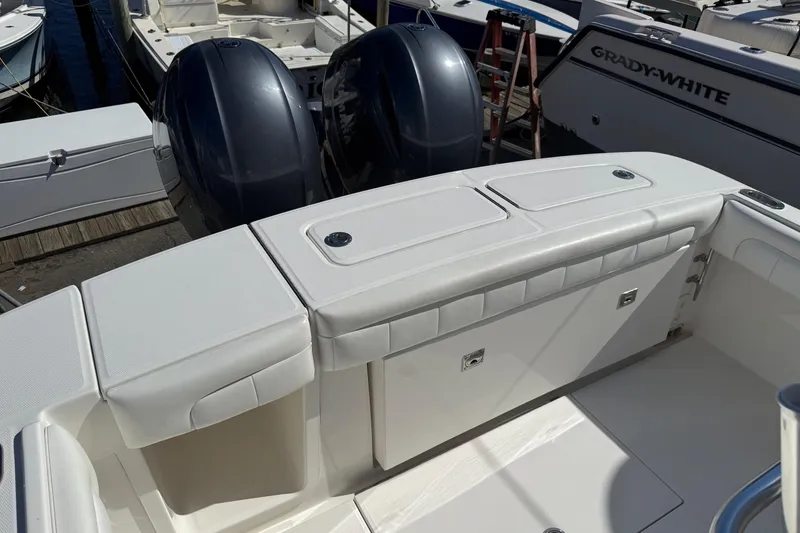 Slide: The Image of 2017 Regulator 25 boat with dual outboard engines at dock. - 32