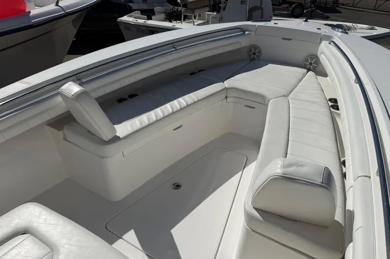 Slide: The Image of 2017 Regulator 25 boat with white cushioned seating and stainless steel railings. - 39