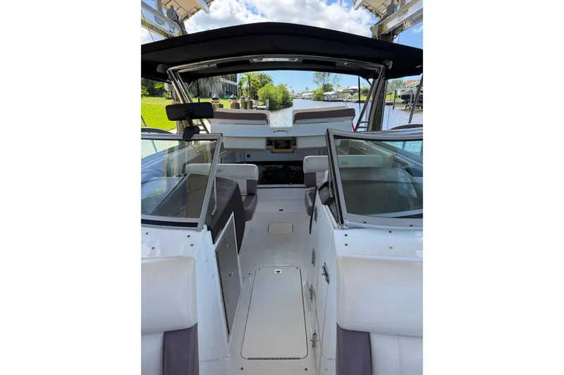 Slide: The Image of Interior view of 2010 Cobalt 296 boat, featuring sleek design and spacious seating. - 13