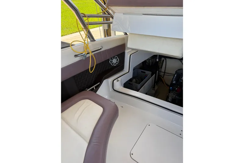 Slide: The Image of Interior view of a 2010 Cobalt 296 boat showing seating and storage area. - 20