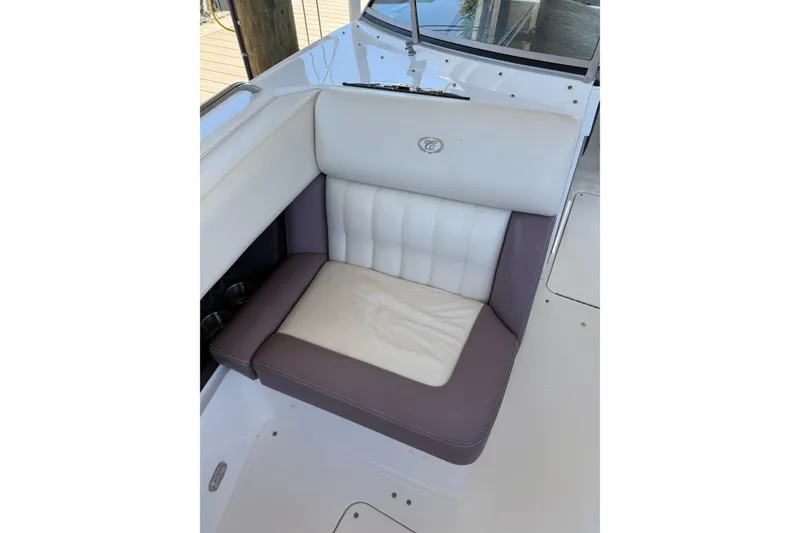 Slide: The Image of 2010 Cobalt 296 boat seat with white and purple upholstery. - 22