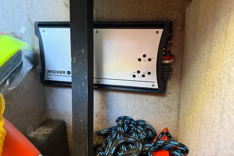 Slide: The Image of Kicker amplifier installed in a 2010 Cobalt 296 boat storage compartment. - 32