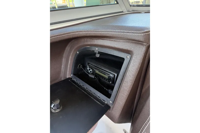 Slide: The Image of 2010 Cobalt 296 boat interior with built-in stereo system. - 36