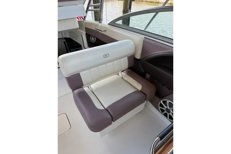 Slide: The Image of 2010 Cobalt 296 boat interior with cushioned seating and speaker detail. - 7