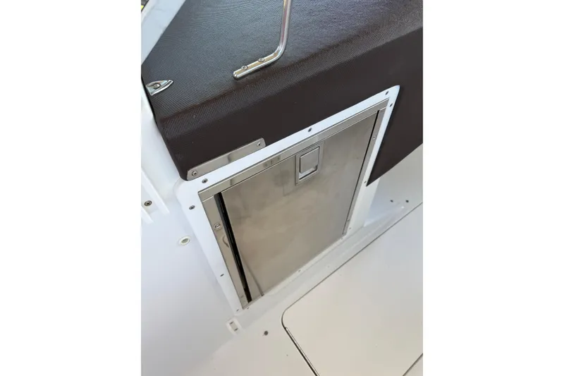Slide: The Image of Stainless steel compartment door on 2010 Cobalt 296 boat interior. - 8