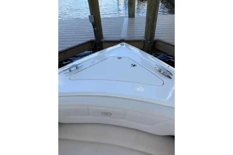 Slide: The Image of Bow of a 2010 Cobalt 296 boat docked by a wooden pier. - 9