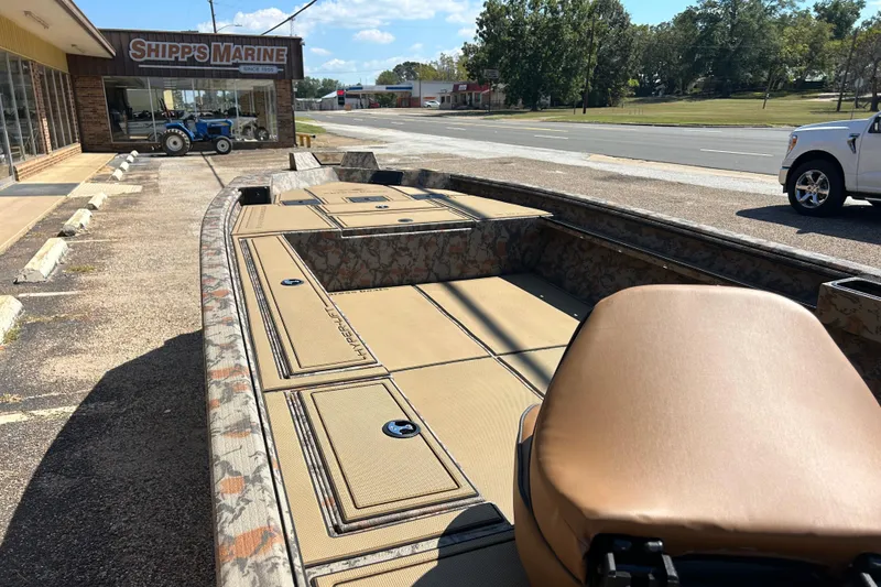 Slide: The Image of 2026 Xpress X18DB boat displayed outside Shipp's Marine dealership. - 8