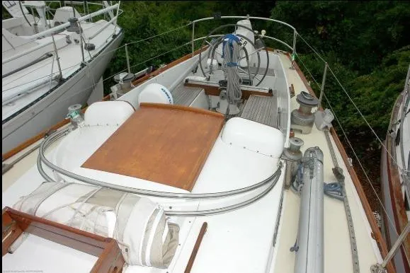 Slide: The Image of 1971 Nautor Swan 43 Sloop deck view with wooden and white accents. - 12