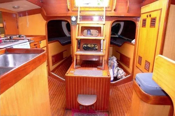 Slide: The Image of Interior of 1971 Nautor Swan 43 Sloop, featuring wooden finishes and compact design. - 6