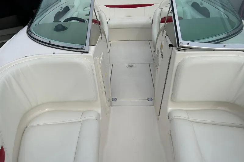 Slide: The Image of Interior of 2000 Chaparral 216 SSi boat with white and red seating. - 13