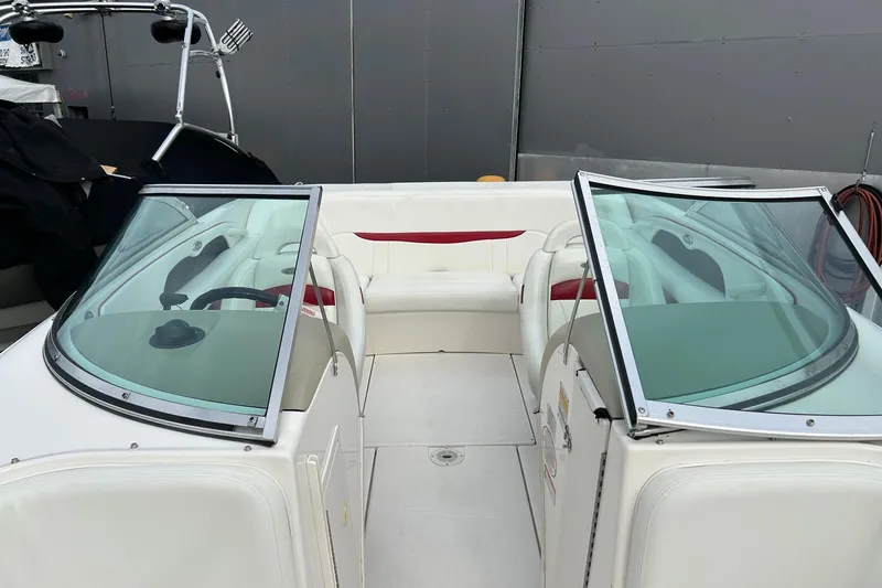 Slide: The Image of Open anchor compartment on 2000 Chaparral 216 SSi boat, showing interior details. - 14