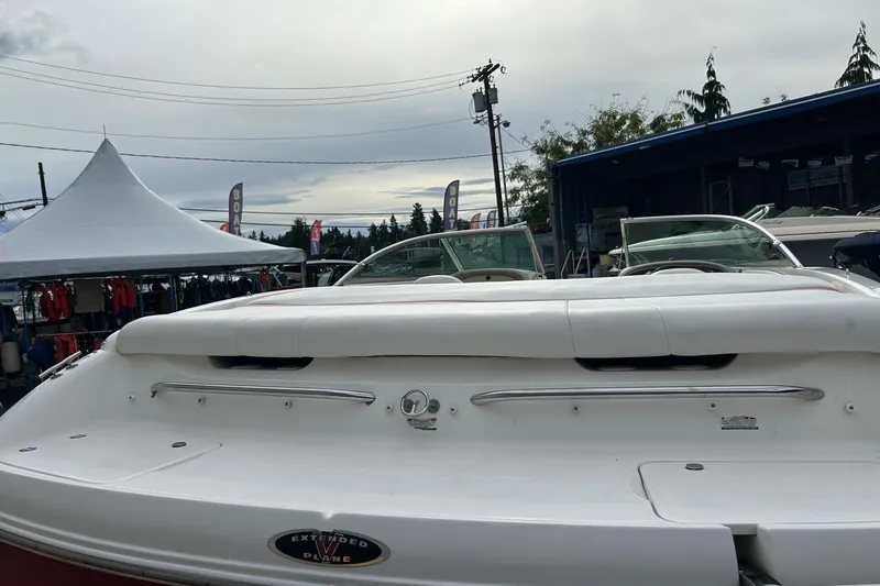 Slide: The Image of 2000 Chaparral 216 SSi boat interior with white seating and windshield. - 16