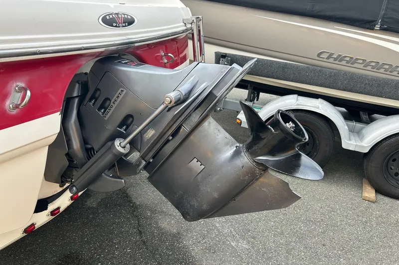 Slide: The Image of 2000 Chaparral 216 SSi boat interior with white seating and open windshield. - 20