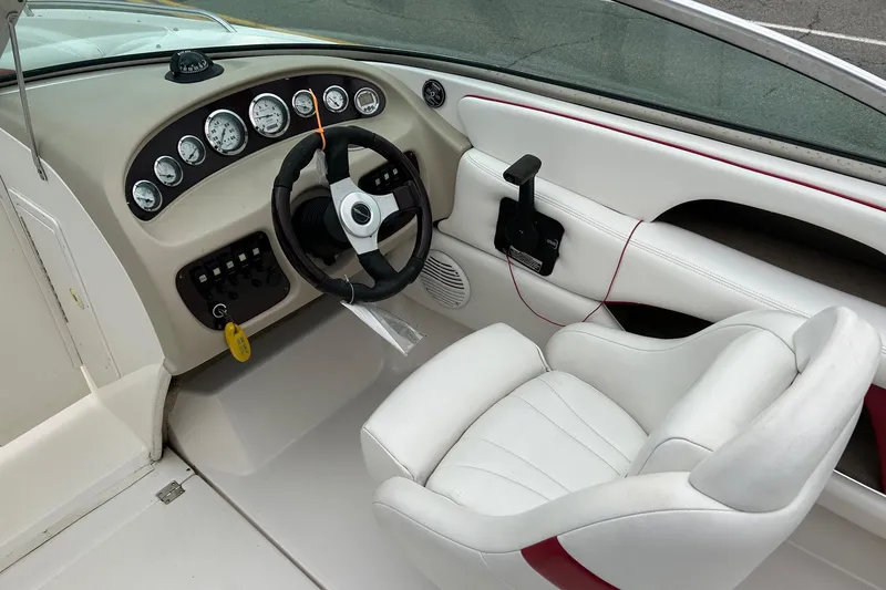 Slide: The Image of Interior of 2000 Chaparral 216 SSi boat with steering wheel and gauges. - 24