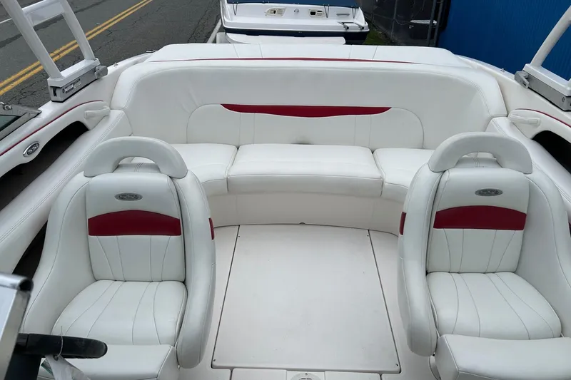 Slide: The Image of Interior of a 2000 Chaparral 216 SSi boat with white and red seating. - 27