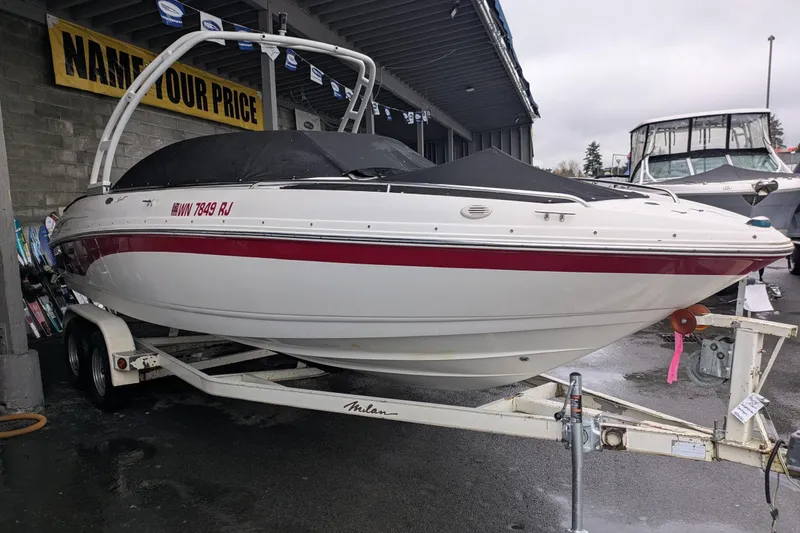 Slide: The Image of 2000 Chaparral 216 SSi boat on trailer, covered and parked outdoors. - 30