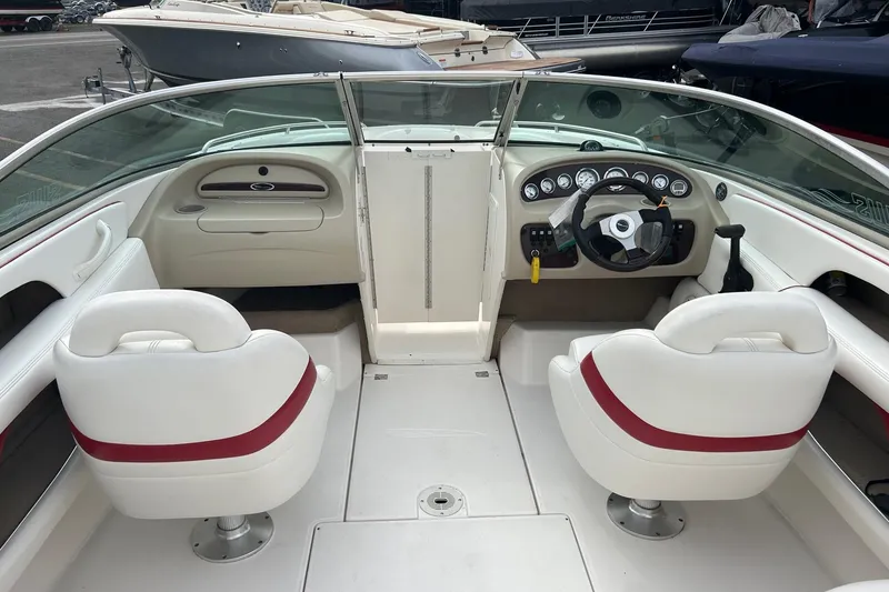 Slide: The Image of Steering wheel and dashboard of 2000 Chaparral 216 SSi boat with gauges. - 5