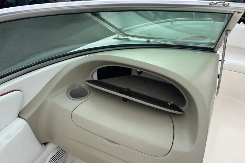 Slide: The Image of Interior of a 2000 Chaparral 216 SSi boat, featuring steering wheel and gauges. - 6