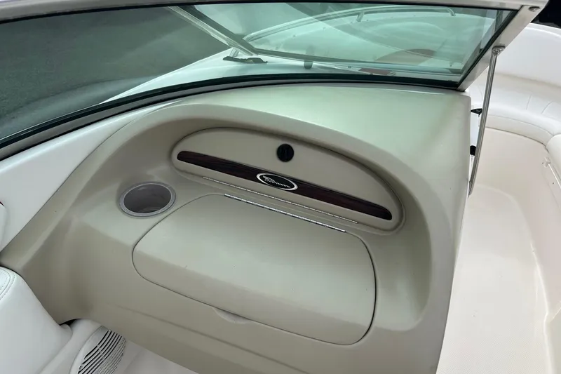 Slide: The Image of Interior of a 2000 Chaparral 216 SSi boat with white seating and dashboard. - 7