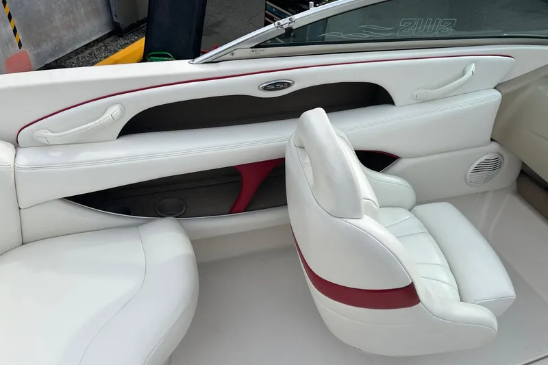 Slide: The Image of 2000 Chaparral 216 SSi boat interior with open glove compartment and cup holder. - 8