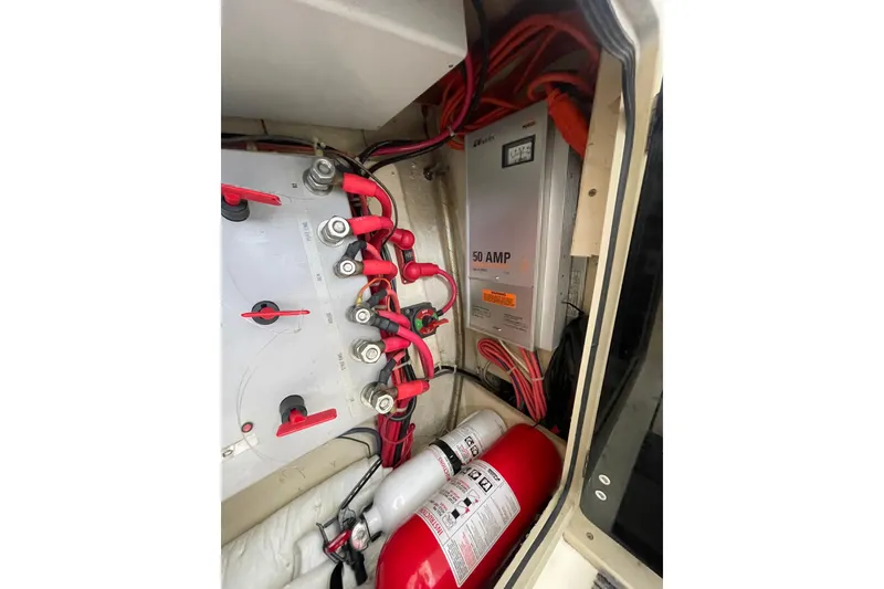 Slide: The Image of Electrical system of a 1999 Albemarle 30 boat with wiring and fire extinguisher. - 11