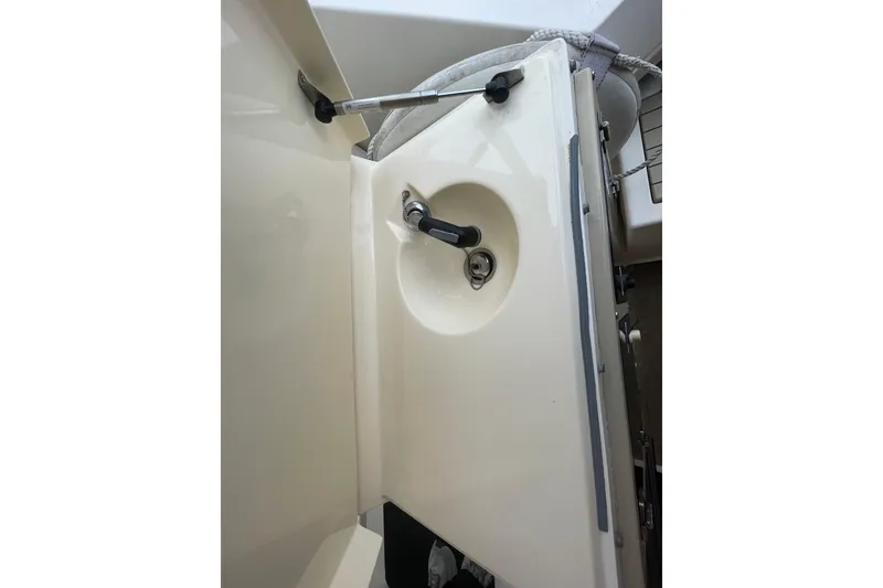 Slide: The Image of 1999 Albemarle 30 boat interior detail with handle and latch mechanism. - 15