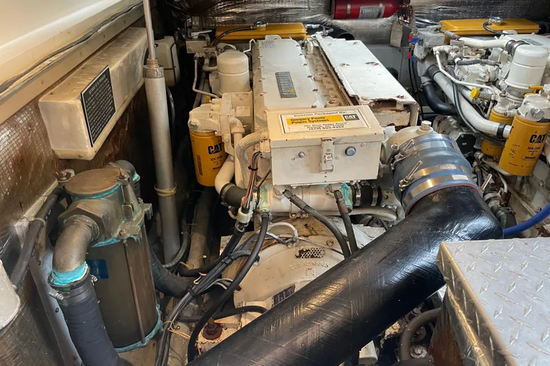 Slide: The Image of Engine room of a 1999 Albemarle 30 boat with Caterpillar components. - 19