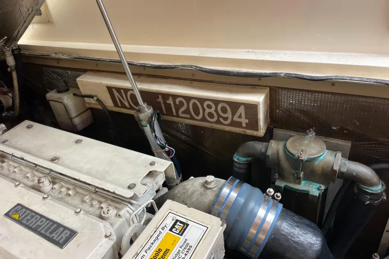 Slide: The Image of Engine compartment of a 1999 Albemarle 30 boat with Caterpillar components. - 24