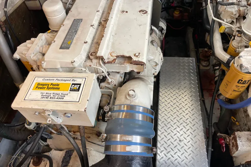 Slide: The Image of Engine compartment of a 1999 Albemarle 30 boat with CAT marine power system. - 27