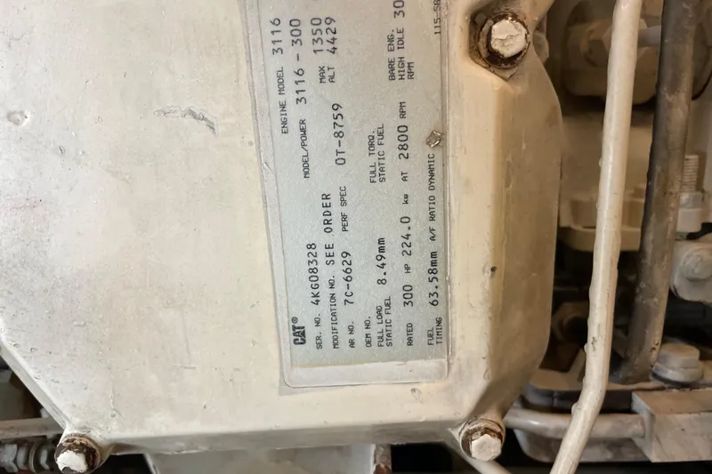 Slide: The Image of Close-up of a 1999 Albemarle 30 engine label with specifications. - 30